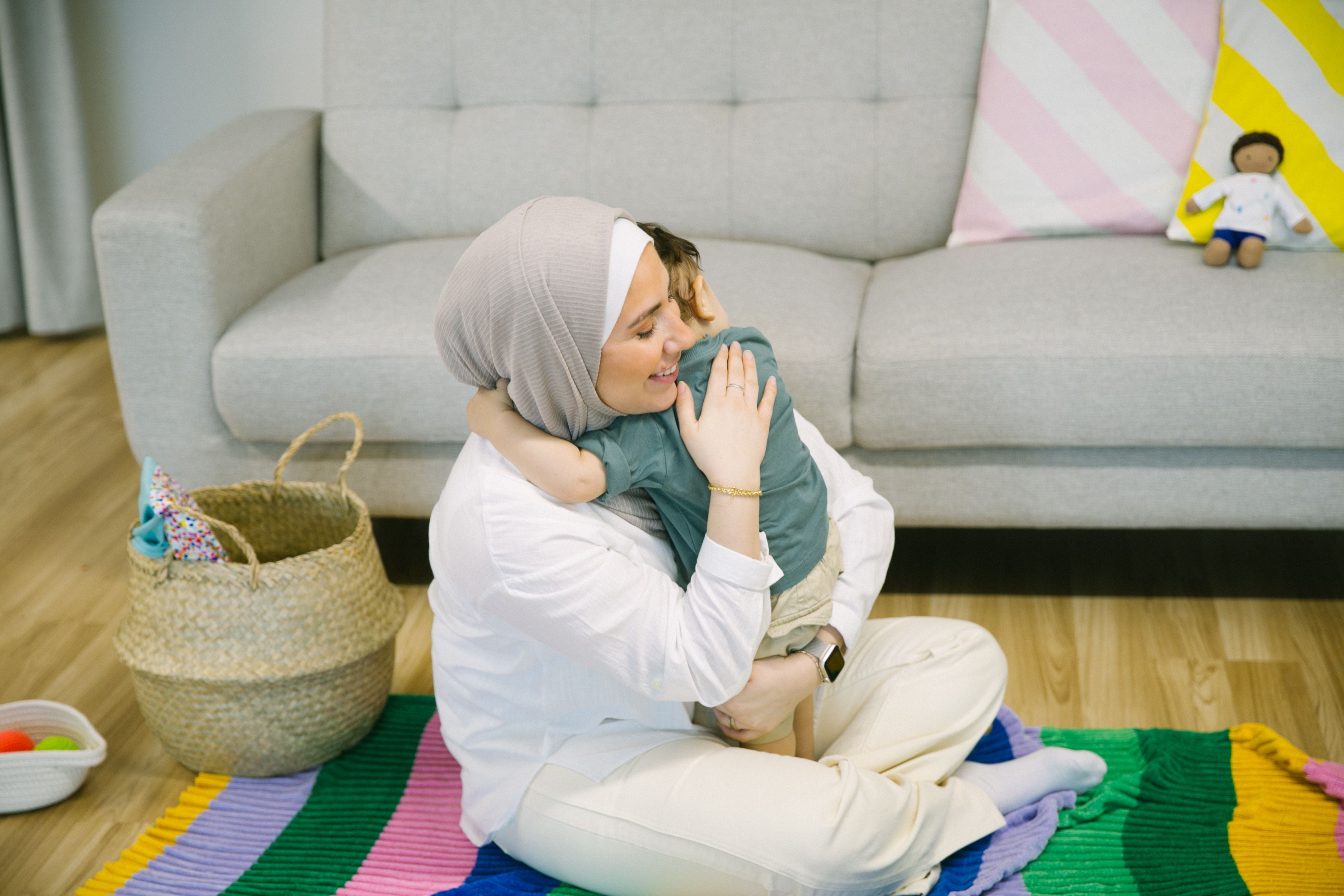 Mother gently soothing her toddler to sleep creating a calming and comforting bedtime routine.